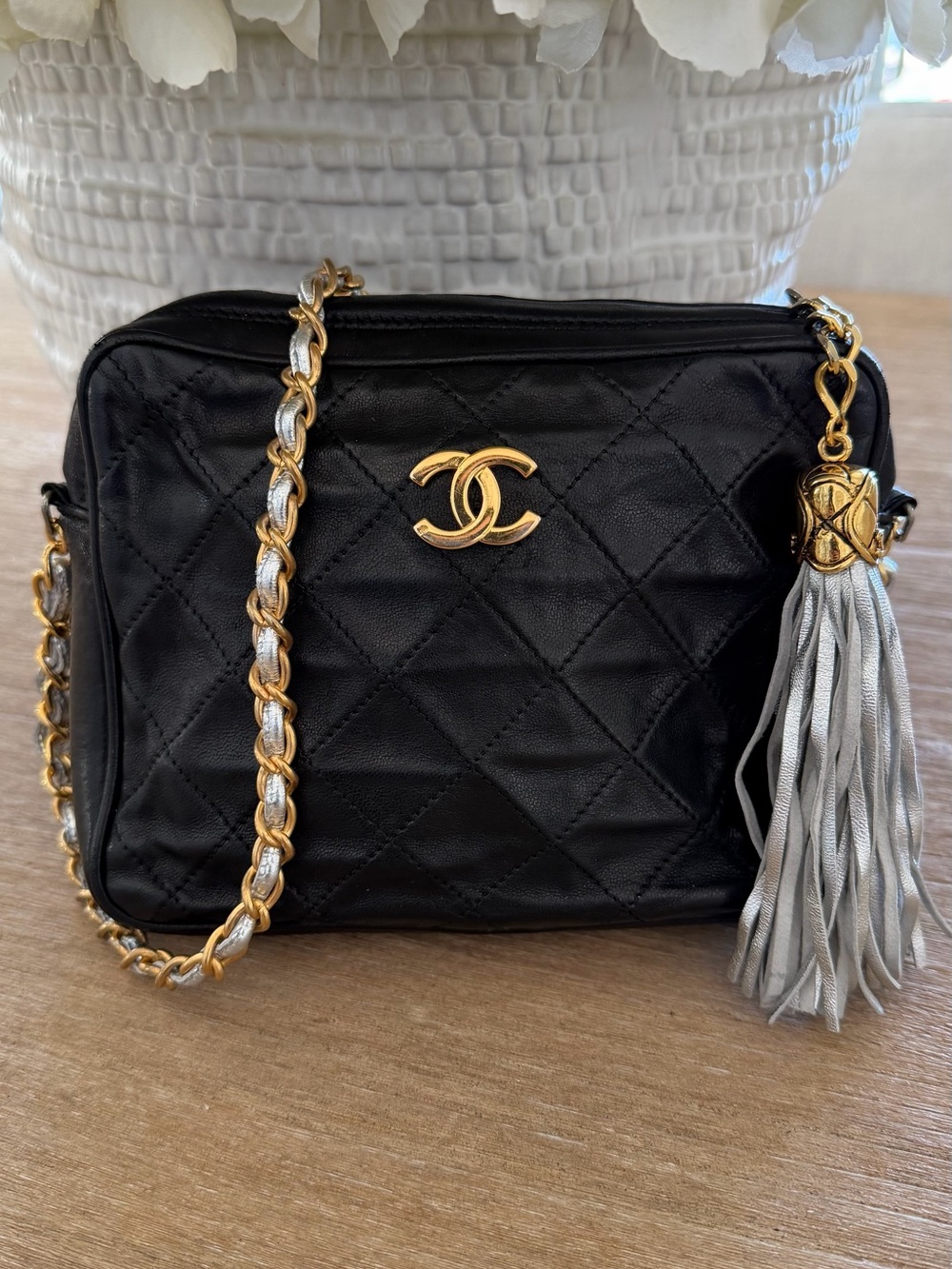CHANEL Black Quilted Leather Crossbody with Gold Chain and Silver Tassel